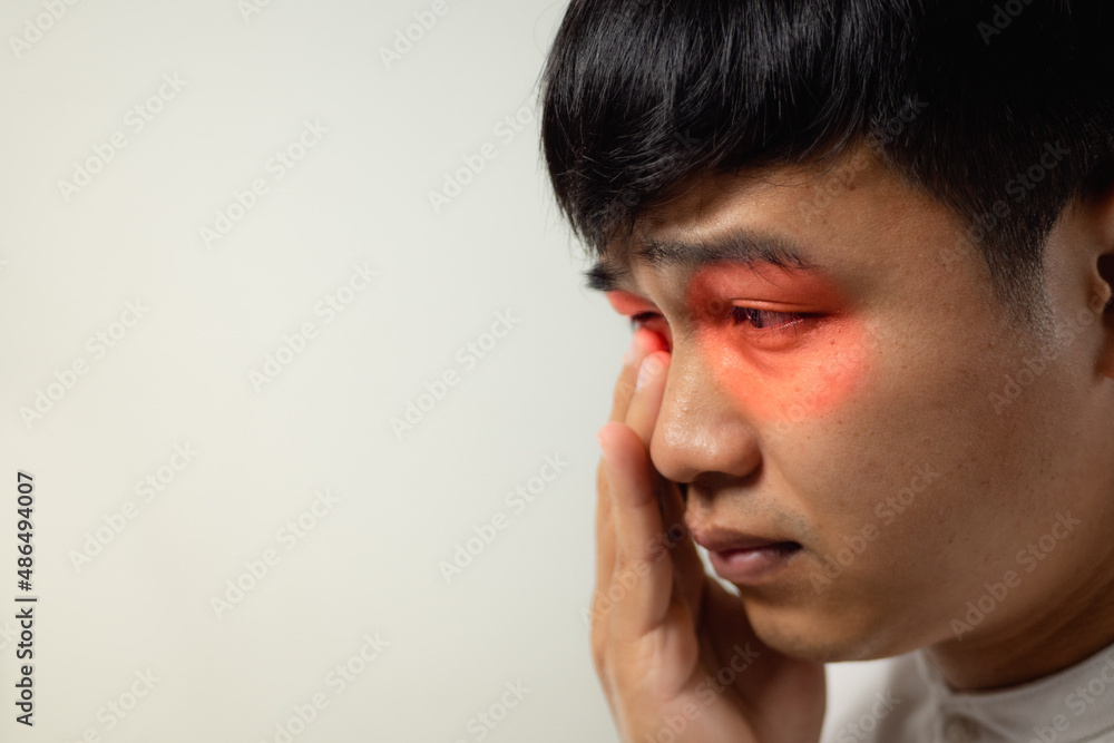 The man pains his eyes. He touches his eye by hands. Ophthalmology concept. This shot is medium close up portrait with copy space. The man pains his eyes. He touches his eye by hands. Ophthalmology concept. This shot is medium close up portrait with copy space.