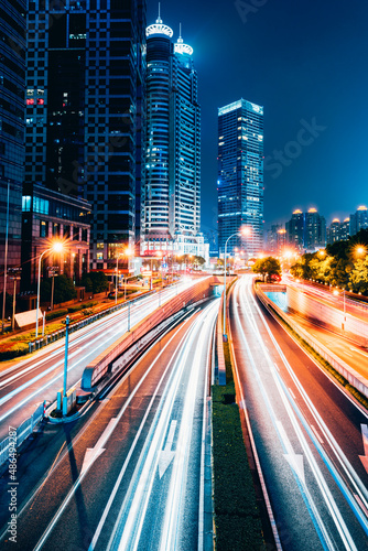 the light trails on the modern building background in shanghai china.