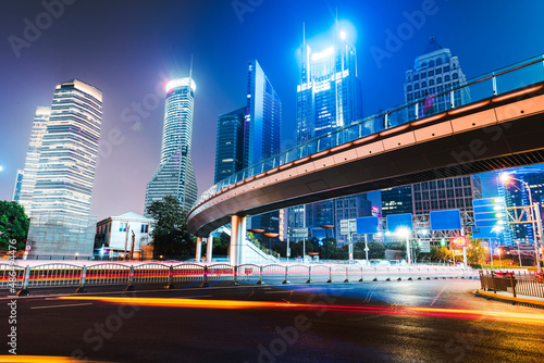 the light trails on the modern building background in shanghai china.