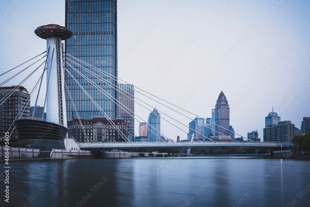 Fototapeta premium The modern city highway Bridges night landscape car light trails arc in tianjin