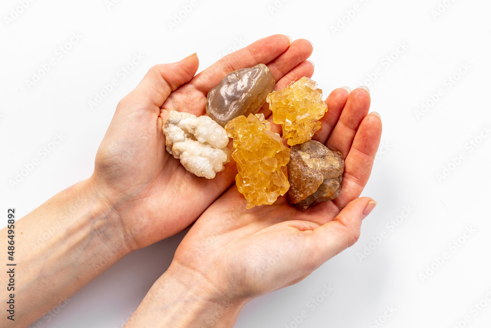 Natural crystal mineral stone in hands. Crystal texture closeup Natural crystal mineral stone in hands. Crystal texture closeup