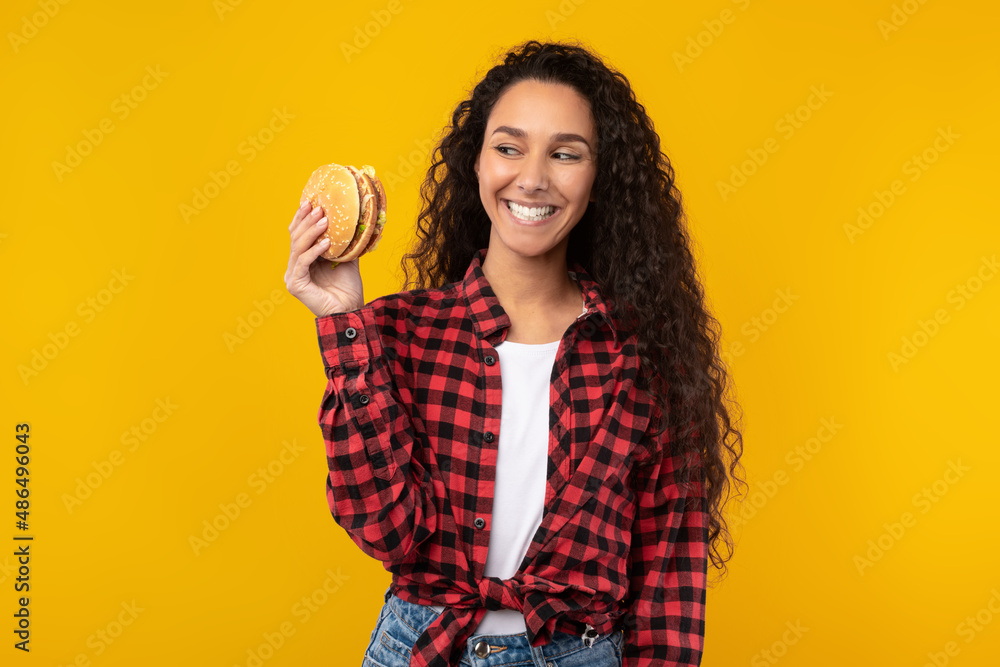 Funny Young Lady Holding Burger At Studio Funny Young Lady Holding Burger At Studio