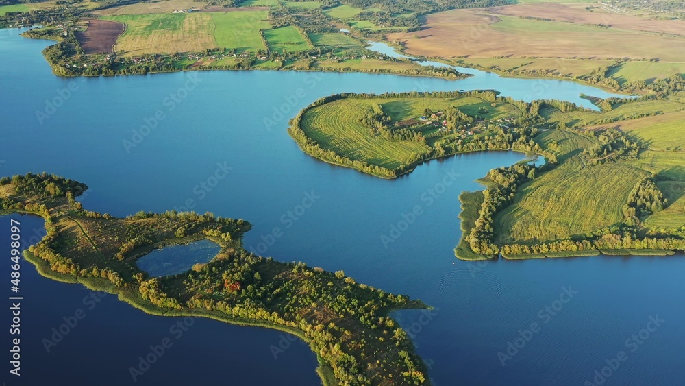 4K Blue Water Of Lake River And Green Countryside Landscape With Growing Greenery Forest. Aerial View Of Rivers Coast Islands. 4K Blue Water Of Lake River And Green Countryside Landscape With Growing Greenery Forest. Aerial View Of Rivers Coast Islands.