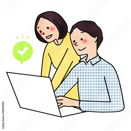 パソコンで予約を入れている男女
