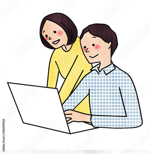 パソコンを見ている男女
