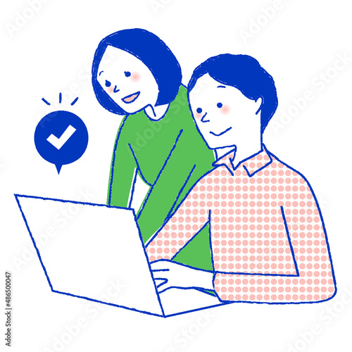 パソコンで予約を入れている男女
