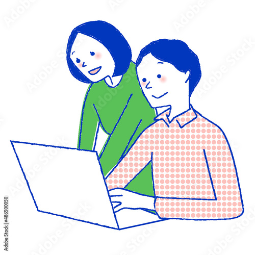 パソコンを見ている男女
