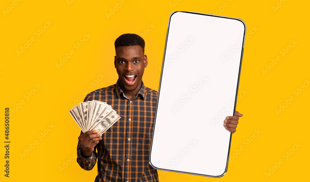 © Prostock-studio - Black guy holding mobey and big white empty smartphone screen © Prostock-studio - Black guy holding mobey and big white empty smartphone screen