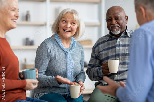 Photography Multiracial group of positive elderly people drinking tea, chatting