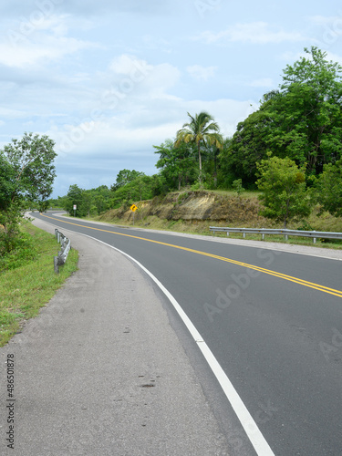 Winding highway asfalt road in tropical country © ALEKSEI
