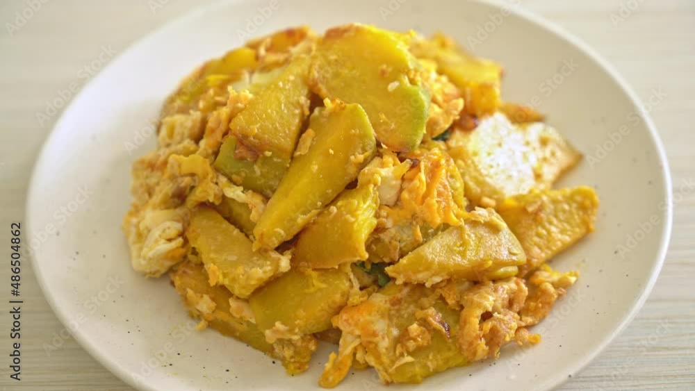 stir-fried pumpkin with egg on plate stir-fried pumpkin with egg on plate