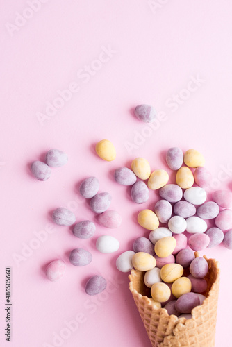 Easter composition with mini chocolate eggs in pastel colors