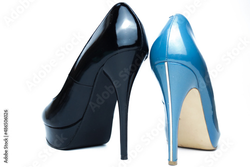 Sexy women's black and blue high-heeled shoes of different models. Isolated on a white background. The concept of choice.