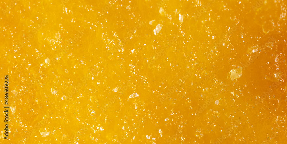 Dried yellow mango pulp as background. Stock Photo Adobe Stock