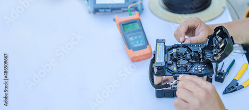 Banner equipment  testing the signal on the fiber optic cable copy space.