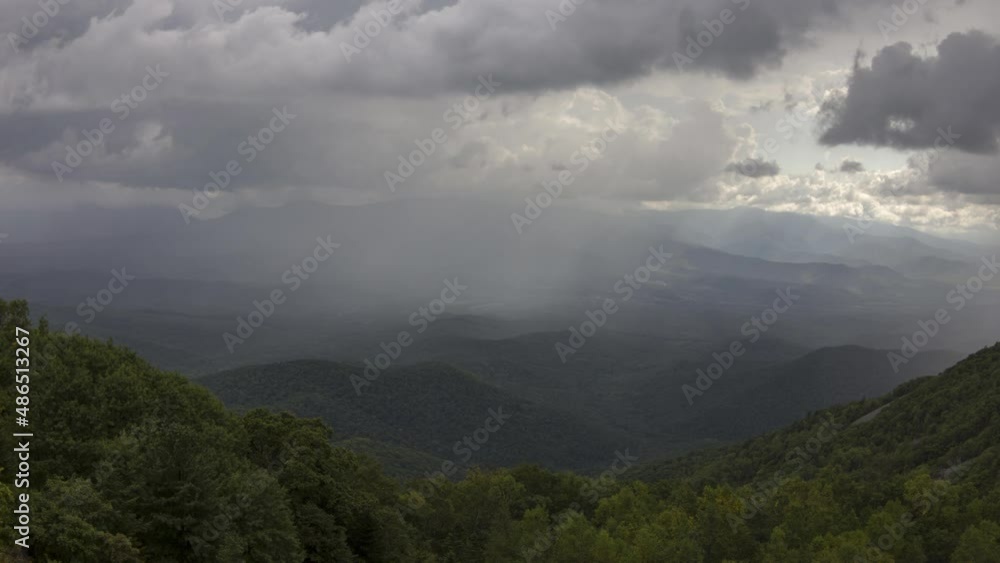 The rain is coming down the valley. Rain clouds swirl in the sky. Timelapse. Summer. The rain is coming down the valley. Rain clouds swirl in the sky. Timelapse. Summer.
