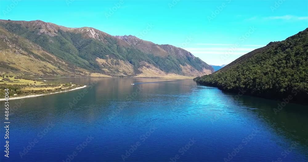 Aerial View of People Water Skiing on Beautiful Lake Taylor, New Zealand - Dolly In Shot Aerial View of People Water Skiing on Beautiful Lake Taylor, New Zealand - Dolly In Shot