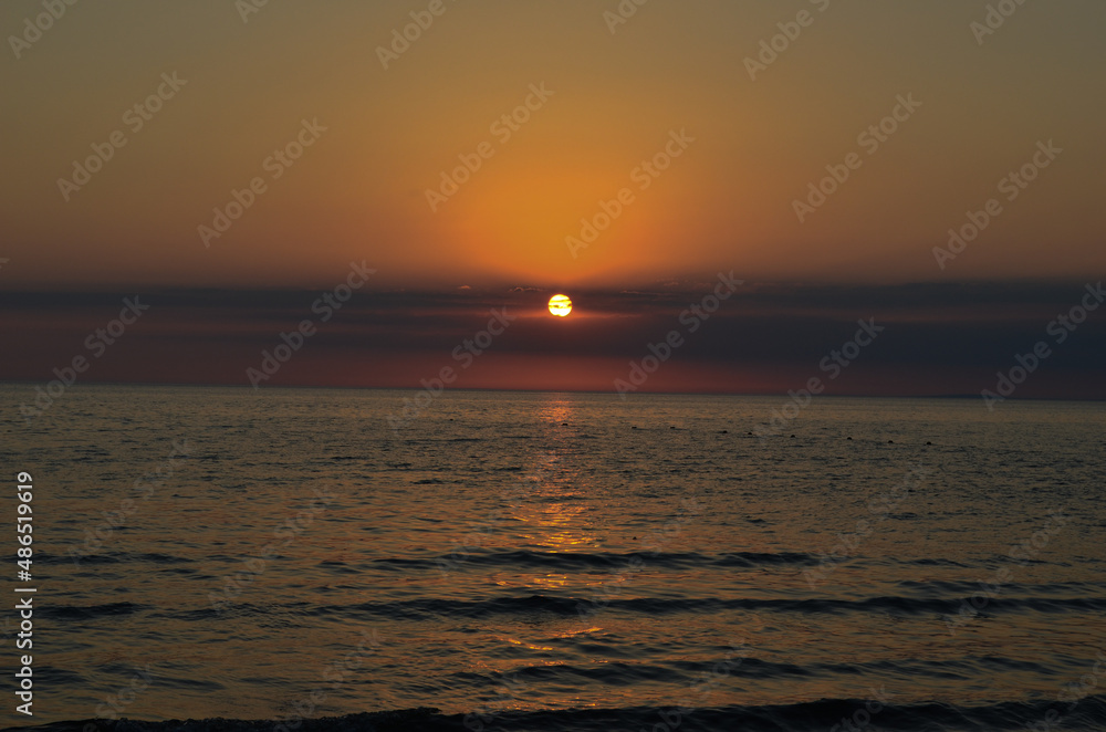 Russia. Beautiful blue water and sunset clouds at sea.Black Sea.Summer seascape. High quality photo