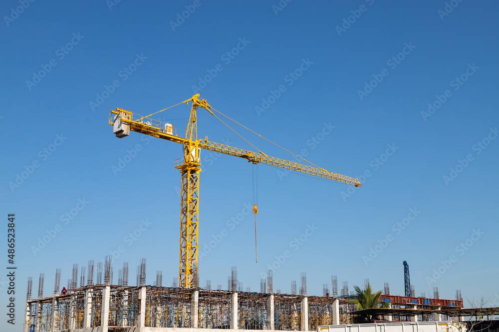 Crane construction of building with blue sky