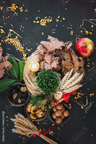 Badnjak or Yule-log, grain and straw, Serbian Christmas. Top view, blank space photo