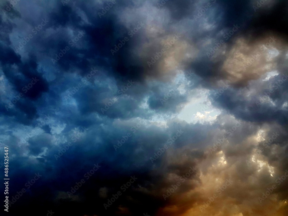Dramatic sky with orange and blue clouds background