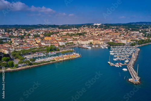 Italian resorts on Lake Garda. Aerial view of Desenzano del Garda. Top view of the boat parking on the lake. Aerial panorama of the town of Desenzano del Garda on Lake Garda in Italy.