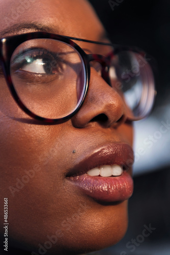 vertical portrait of a black woman in profile