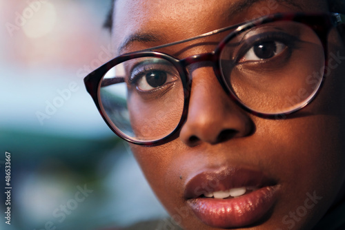 close-up portrait of a young woman wearing glasses