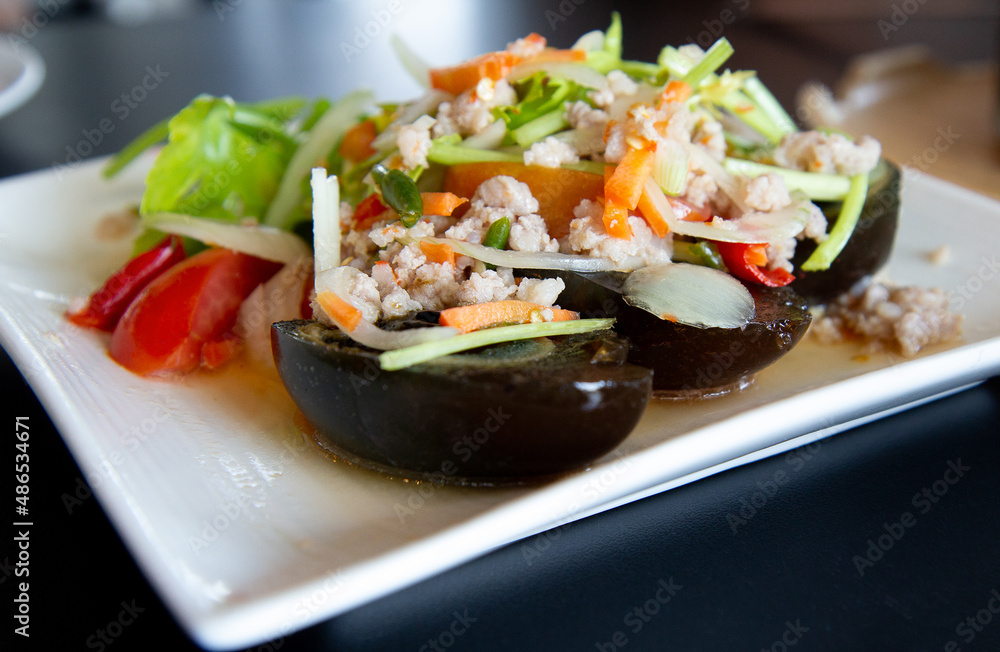 Thai food menu: Spicy Century Eggs Salad with minced pork and Thai herbs