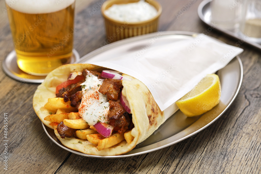 homemade pork meat gyros(pita wrap sandwich) with tzatziki(yogurt sauce), Greek food homemade pork meat gyros(pita wrap sandwich) with tzatziki(yogurt sauce), Greek food