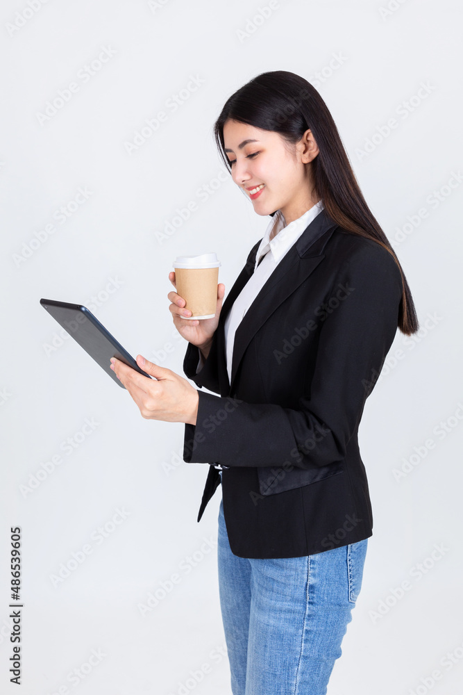 Asian business woman successful holding coffee cup and digital table. Asian business woman successful holding coffee cup and digital table.