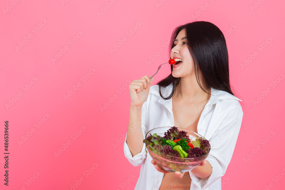 asian woman eating healthy fresh vegetable with copy space, Beauty healthcare diet and vegetarian lifestyle concept. asian woman eating healthy fresh vegetable with copy space, Beauty healthcare diet and vegetarian lifestyle concept.