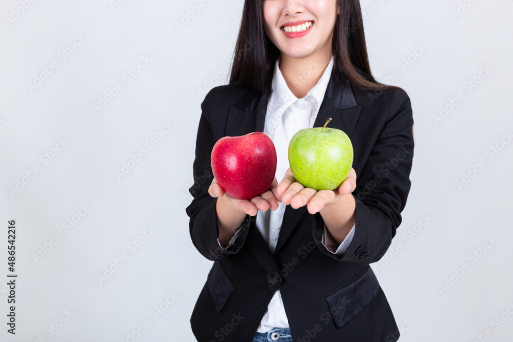 pretty woman holding green apple and red apple , attractive asian people drink beverage smart, People lifestyle concept. pretty woman holding green apple and red apple , attractive asian people drink beverage smart, People lifestyle concept.