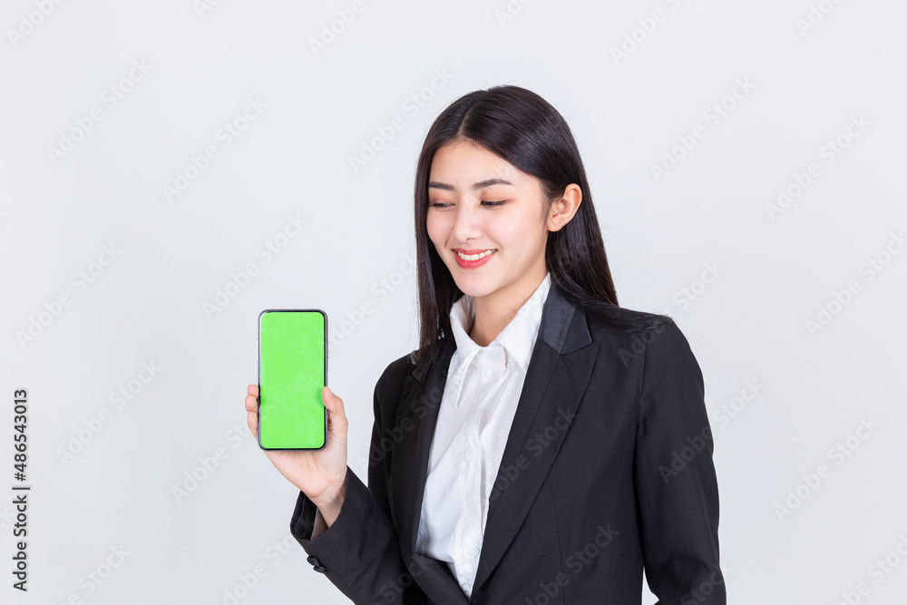 business asian woman wearing office clothing successful hold smart phone mobile and computer laptop , Technology communication lifestyles concept. business asian woman wearing office clothing successful hold smart phone mobile and computer laptop , Technology communication lifestyles concept.