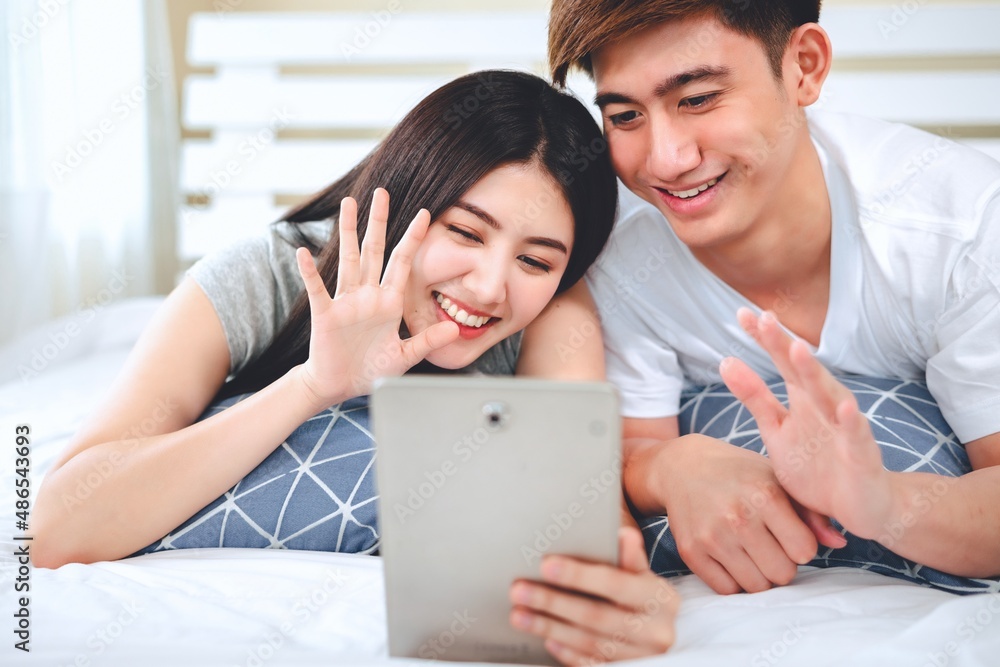 asian couple using tablet or computer start a business selling products online. asian couple using tablet or computer start a business selling products online.