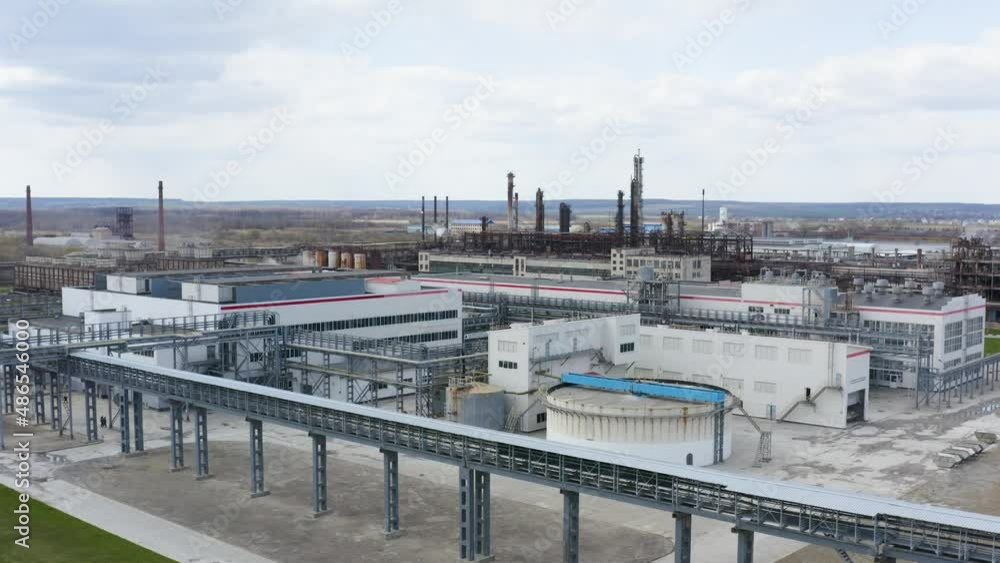 Chemical processing plant. Aerial view of Modern high-tech production. A giant chemical plant. A huge oil refinery with pipes and distillation of the complex. Chemical processing plant. Aerial view of Modern high-tech production. A giant chemical plant. A huge oil refinery with pipes and distillation of the complex.