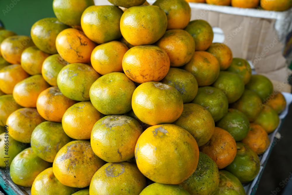 Indonesian local citrus fruit that tastes sweet and the color is a mixture of orange and green. This fruit is widely sold at a low price. This orange is not inferior in quality to imported oranges.