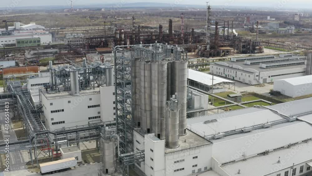 Chemical processing plant. Aerial view of Modern high-tech production. A giant chemical plant. A huge oil refinery with pipes and distillation of the complex. Chemical processing plant. Aerial view of Modern high-tech production. A giant chemical plant. A huge oil refinery with pipes and distillation of the complex.