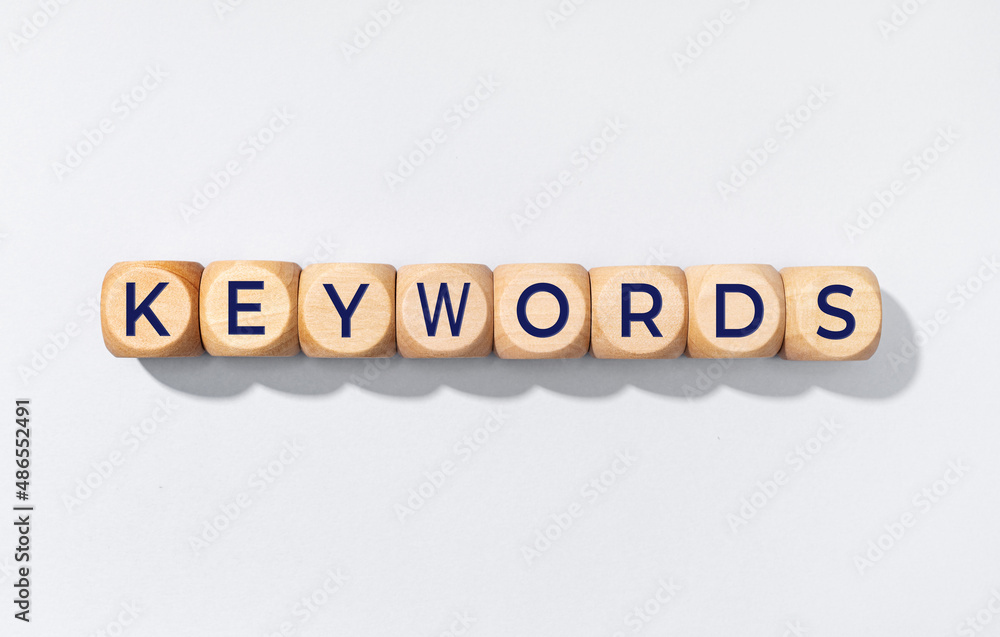 Keywords word on wooden blocks isolated on gray background