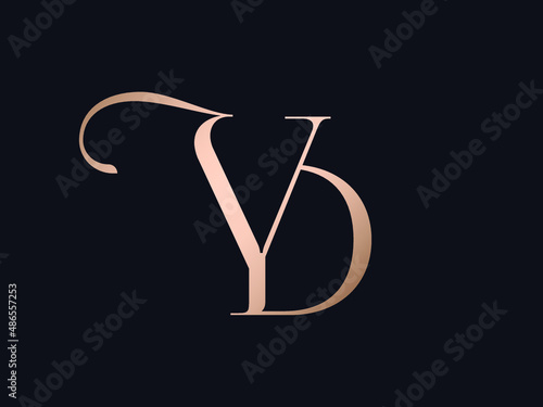 YD monogram logo.Typographic signature icon.Letter y and letter d.Lettering sign isolated on dark fund.Wedding, fashion, beauty alphabet initials.Elegant, luxury style.Rose gold color.	