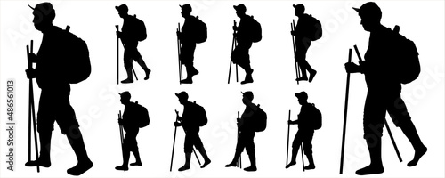 A tourist with a backpack on her back and walking sticks in her hand. The elderly woman walks. Woman on the move. Hiking. Side view, profile. Black female silhouettes isolated on white background.