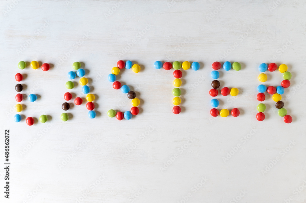 The word 'Easter' made of small, colourful chocolates. The word 'Easter' made of small, colourful chocolates.