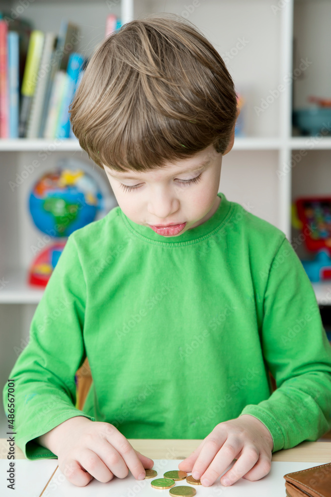 kid counting money from the wallet. Symbol changes in global market, economic instability, inflation, rising prices, taxes, crisis. Kids budget, savings for future education. kid counting money from the wallet. Symbol changes in global market, economic instability, inflation, rising prices, taxes, crisis. Kids budget, savings for future education.