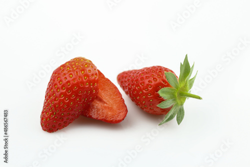 Strawberry isolated. Strawberries isolate. Whole, half, cut strawberry on white. Strawberries isolate. Side view organic strawberries. Full depth of field.