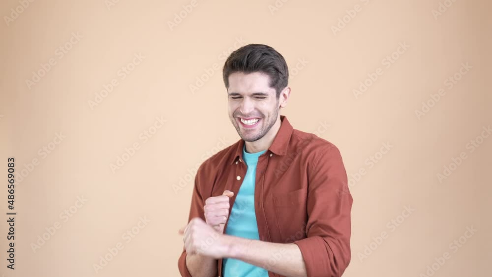 Cheerful guy clench fist up win lucky jackpot isolated pastel color background Cheerful guy clench fist up win lucky jackpot isolated pastel color background