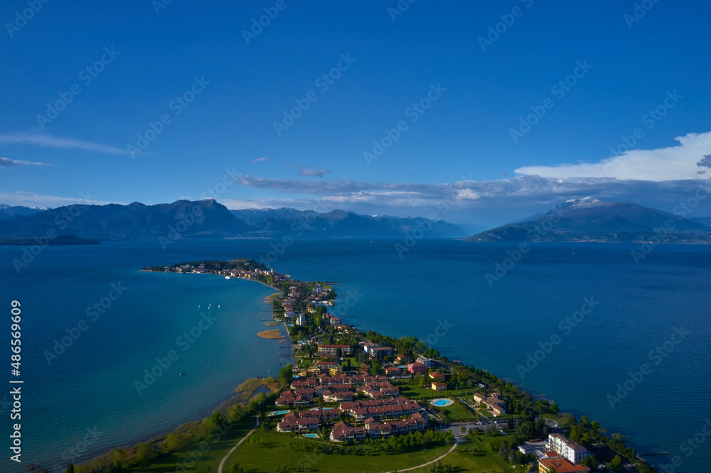 Sirmione in Italy aerial view. Aerial panorama of the Sirmione peninsula. Sirmione on Lake Garda drone view. Panorama of Lake Garda. Sirmione, Lake Garda, Italy. Drone view of Sirmione.