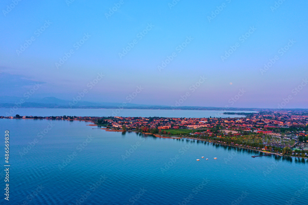 Sirmione on Lake Garda drone view. Panorama of Lake Garda. Sirmione, Lake Garda, Italy. Drone view of Sirmione. Sirmione aerial view. Aerial panorama of the Sirmione peninsula.