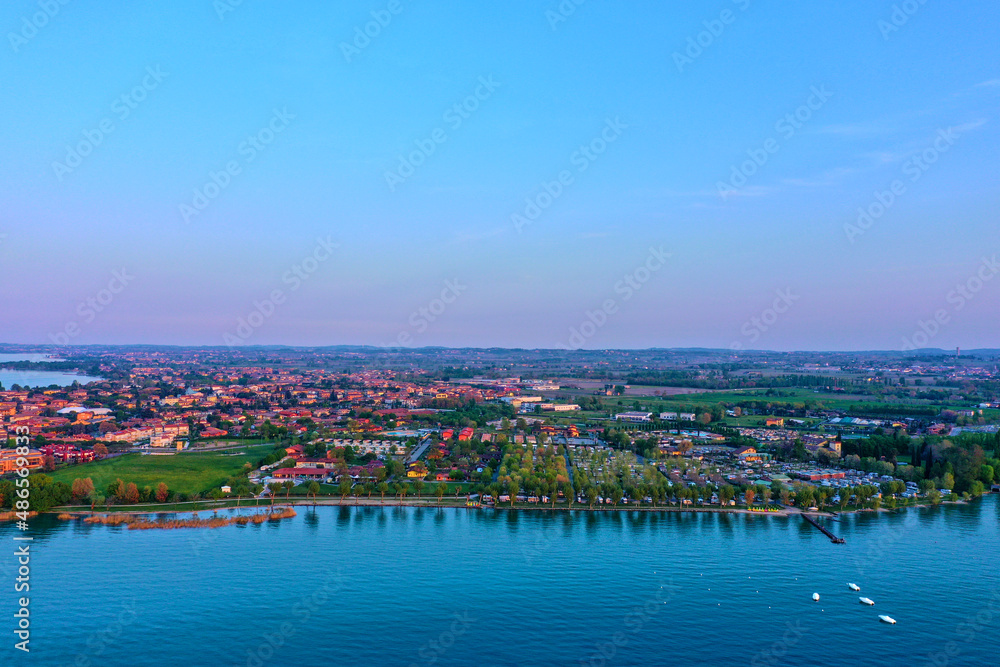Sirmione, Lake Garda, Italy. Drone view of Sirmione. Sirmione aerial view. Aerial panorama of the Sirmione peninsula. Sirmione on Lake Garda drone view. Panorama of Lake Garda.