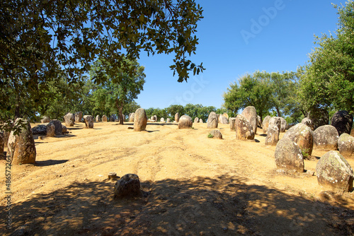 neolithic stones circle  on  Almendres Cromlech  a megalithic complex of more than 100 stones in Alentejo region , Evora, Portugal photo