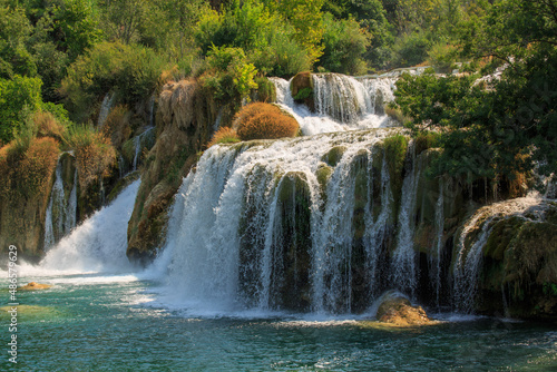 View of waterfall cascade on a sunny day in Krka National Park, Croatia